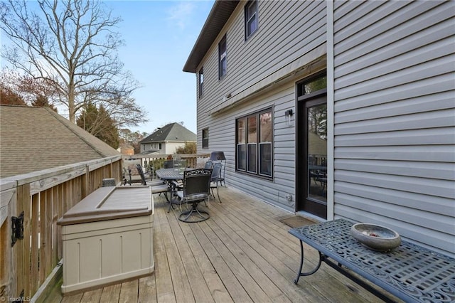 wooden deck featuring outdoor dining area