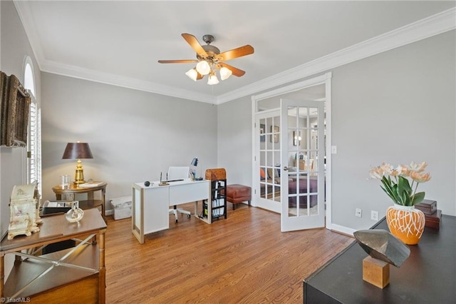 office space with french doors, wood finished floors, a ceiling fan, and crown molding