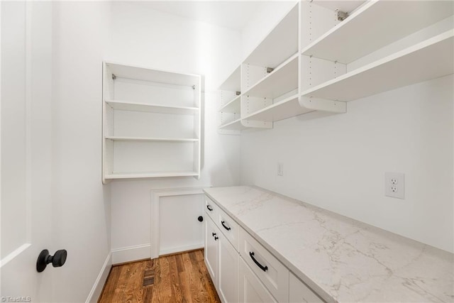 pantry featuring dark hardwood / wood-style flooring