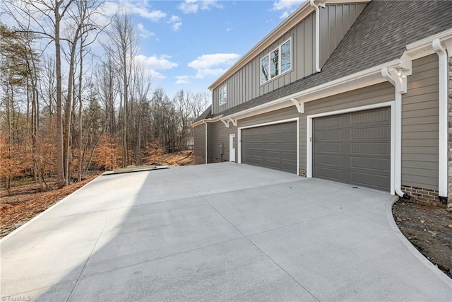 view of side of home featuring a garage