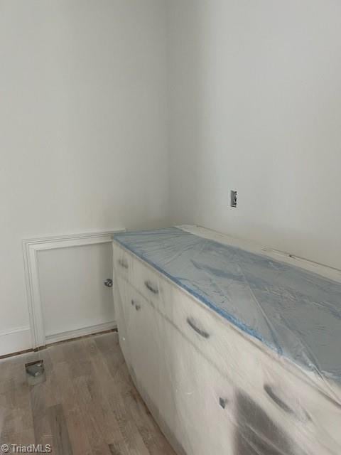 bathroom with hardwood / wood-style floors