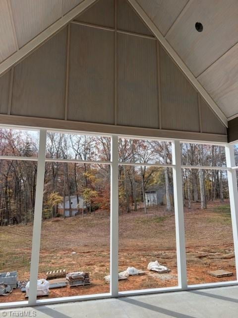 unfurnished sunroom with vaulted ceiling