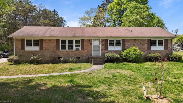 ranch-style home with a front lawn, brick siding, and crawl space