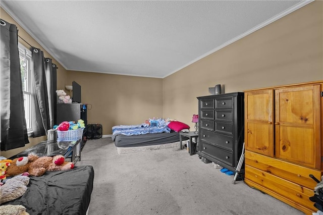 carpeted bedroom featuring a textured ceiling, baseboards, and ornamental molding