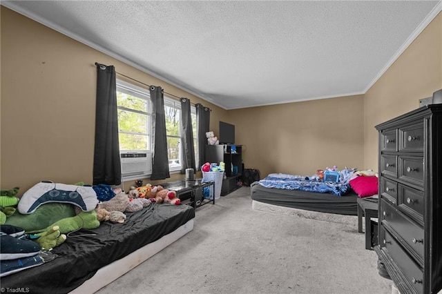 carpeted bedroom featuring ornamental molding, a textured ceiling, and cooling unit