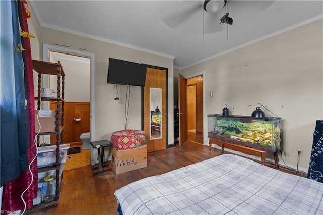 bedroom with wood-type flooring, ornamental molding, and a ceiling fan