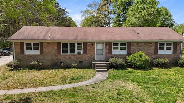 single story home with brick siding, crawl space, and a front yard