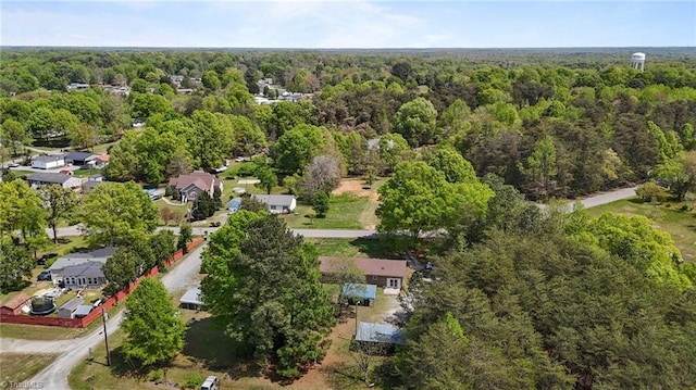 bird's eye view featuring a wooded view