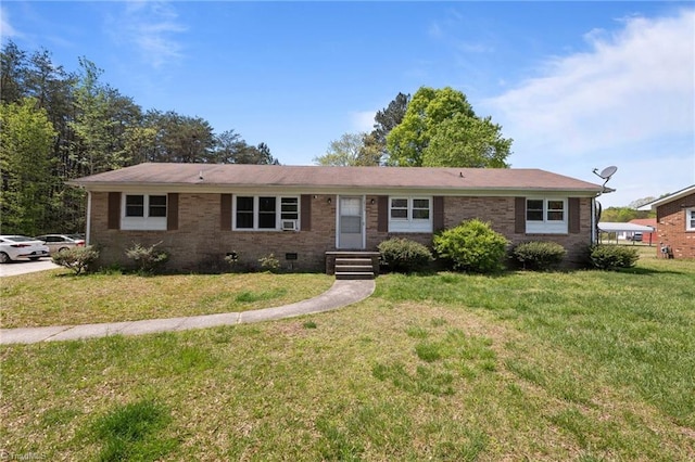 ranch-style house featuring brick siding, crawl space, and a front yard