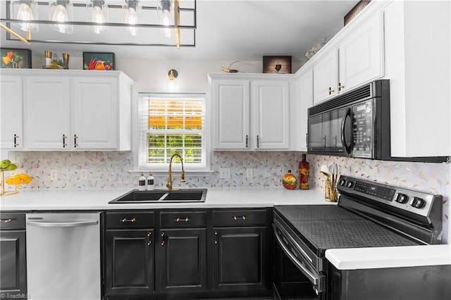 kitchen with white cabinets, black microwave, a sink, electric range oven, and dishwasher