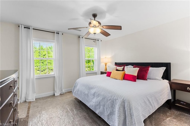 bedroom with baseboards, ceiling fan, and carpet