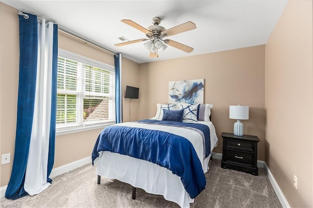 bedroom featuring baseboards, a ceiling fan, carpet flooring, and visible vents