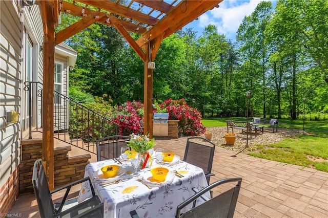 view of patio featuring a pergola, outdoor dining area, and stairs