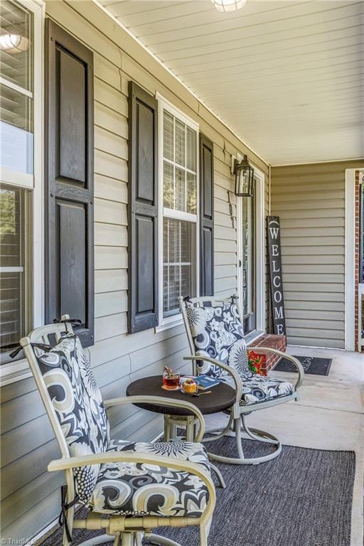 view of patio featuring a porch