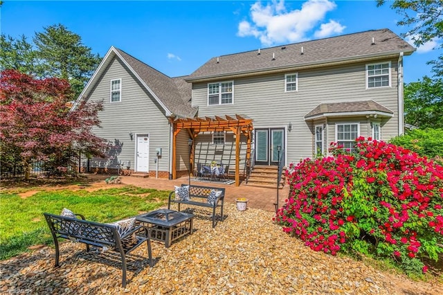 rear view of property featuring a patio, an outdoor fire pit, a yard, and a pergola