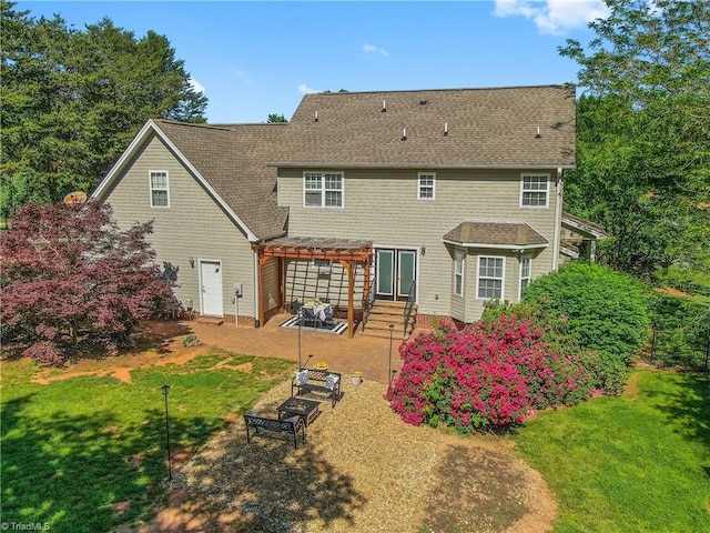 rear view of property with a yard, a pergola, a patio area, and entry steps