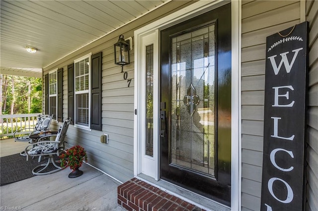 property entrance featuring a porch