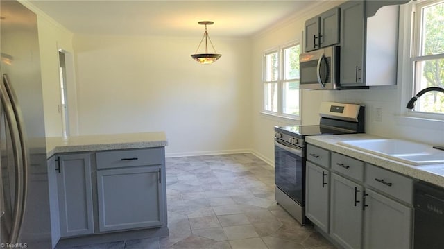 313 Farmstead Rd, King, NC 27021 - kitchen featuring stainless steel appliances, plenty of natural light, light countertops, and ornamental molding
