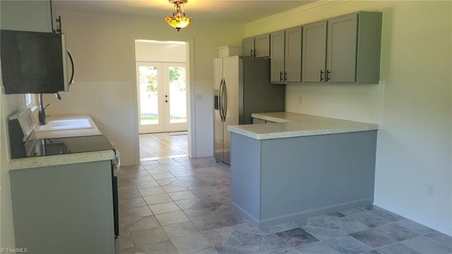 313 Farmstead Rd, King, NC 27021 - kitchen with french doors, light countertops, stainless steel fridge, a peninsula, and crown molding