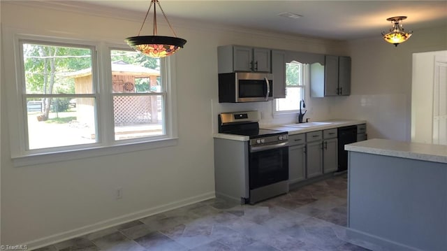 313 Farmstead Rd, King, NC 27021 - kitchen featuring stainless steel appliances, light countertops, gray cabinetry, ornamental molding, and hanging light fixtures