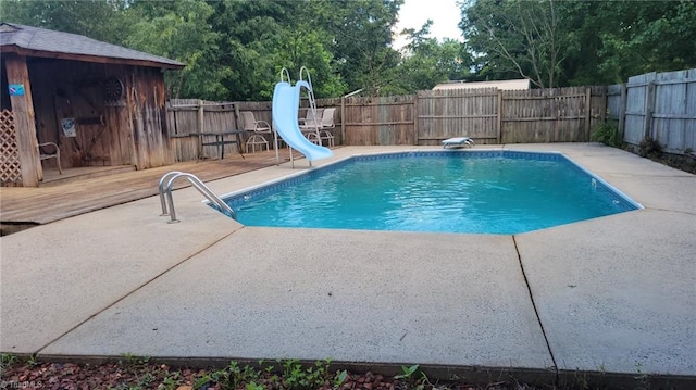 313 Farmstead Rd, King, NC 27021 - view of swimming pool with a water slide, a fenced backyard, and a patio area