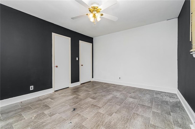 2110 E Green Dr, High Point, NC 27260 - unfurnished room with a ceiling fan and baseboards