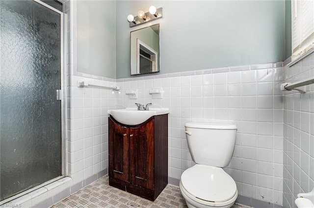2110 E Green Dr, High Point, NC 27260 - bathroom with tile walls, toilet, a shower stall, and vanity