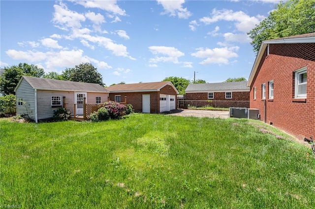 2110 E Green Dr, High Point, NC 27260 - view of yard with cooling unit, an outdoor structure, and a garage