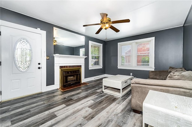 2110 E Green Dr, High Point, NC 27260 - living area with a fireplace with flush hearth, wood finished floors, baseboards, and ceiling fan