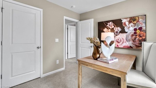 home office featuring baseboards and carpet flooring