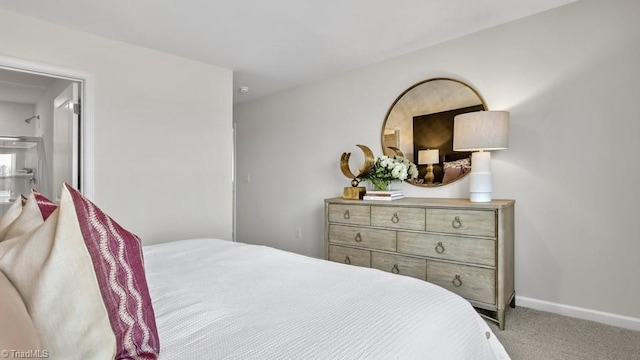 bedroom featuring baseboards and carpet