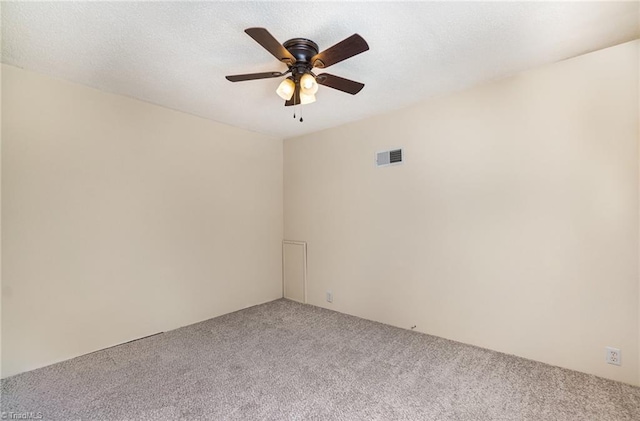 empty room with ceiling fan and carpet floors