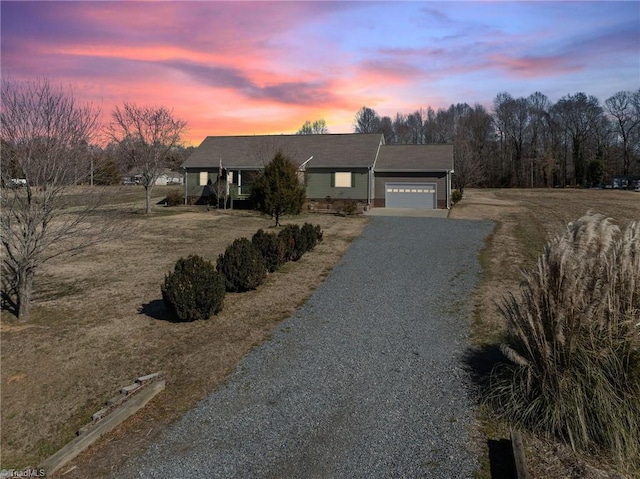 single story home featuring a garage