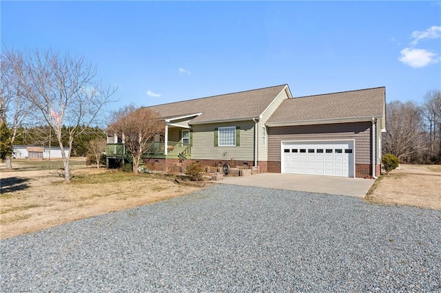 view of front of property with a garage and covered porch