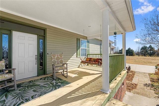 doorway to property with covered porch