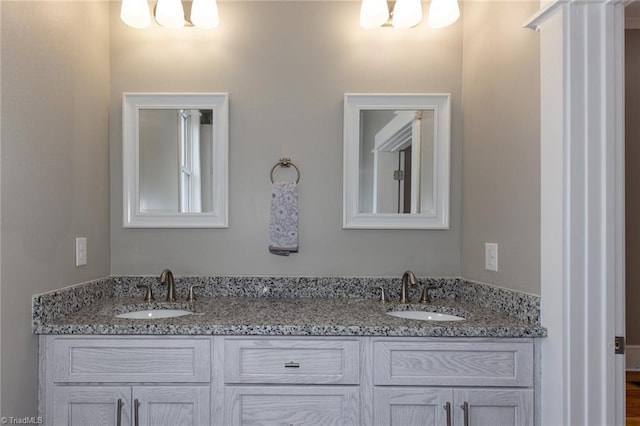 bathroom featuring vanity and an inviting chandelier