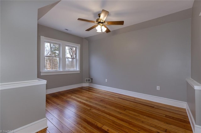 empty room featuring light hardwood / wood-style flooring and ceiling fan