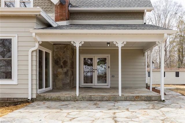 property entrance with a patio area and french doors