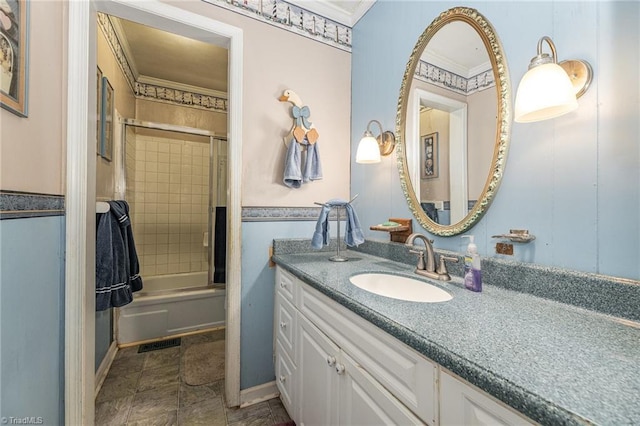 bathroom featuring combined bath / shower with glass door, vanity, and crown molding