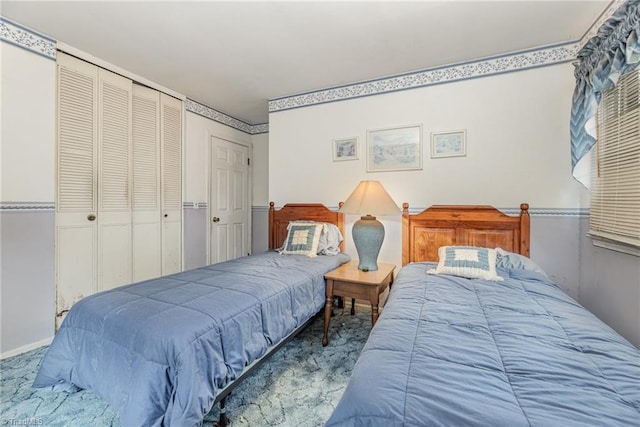 carpeted bedroom with a closet