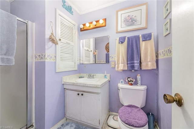 bathroom with an enclosed shower, vanity, toilet, and crown molding