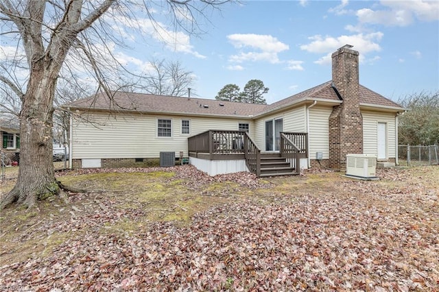 rear view of property with a deck and central air condition unit