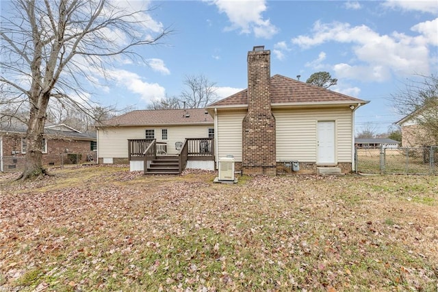 rear view of house featuring a deck