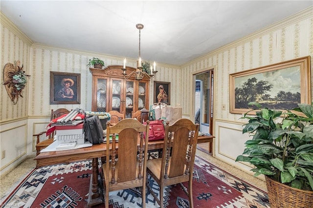 dining space featuring a notable chandelier, carpet floors, and ornamental molding