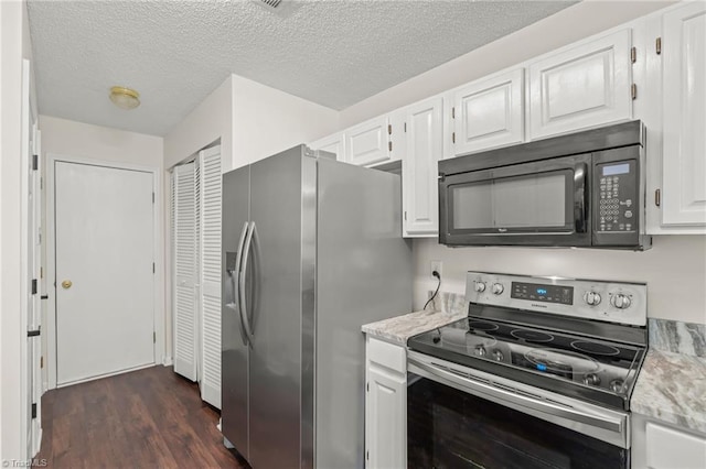 kitchen with light stone counters, dark wood-type flooring, a textured ceiling, white cabinets, and appliances with stainless steel finishes