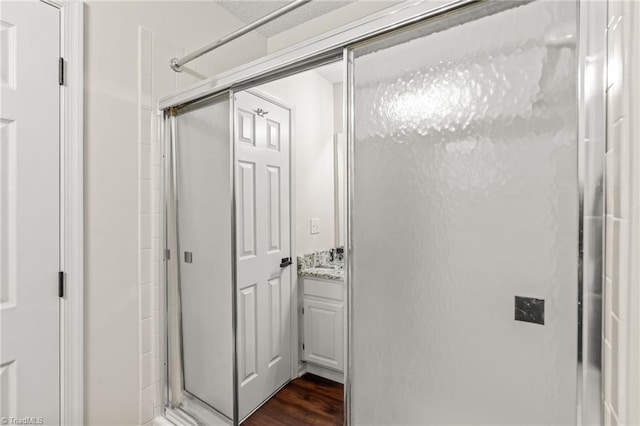 corridor featuring sink and dark hardwood / wood-style flooring