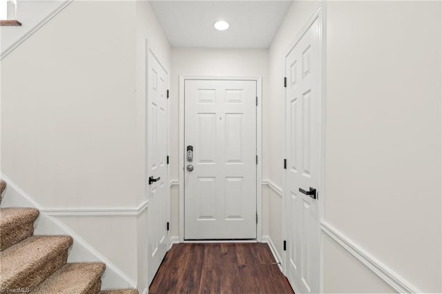 doorway with dark hardwood / wood-style floors