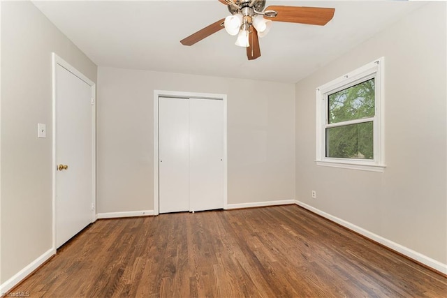 1705 Boyden St, Greensboro, NC 27403 - unfurnished bedroom featuring wood finished floors, baseboards, a closet, and a ceiling fan