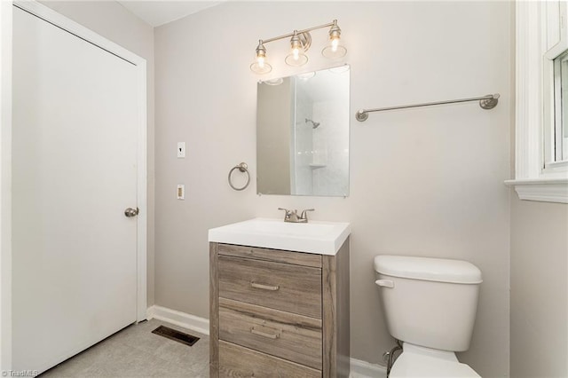 1705 Boyden St, Greensboro, NC 27403 - bathroom featuring toilet, vanity, and baseboards