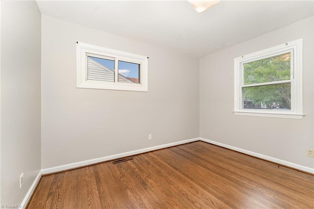 1705 Boyden St, Greensboro, NC 27403 - empty room featuring wood finished floors and baseboards